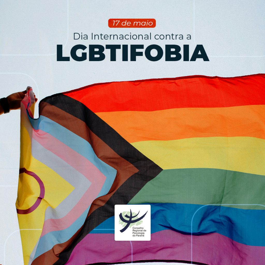Texto: 17 de maio, Dia Internacional de Combate à LGBTIfobia. O fundo da imagem é branco, com a bandeira arco-íris LGBTQIAPN+.